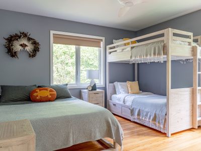 The first bedroom has a delightful bunk bed with twin mattresses and is accompanied by a queen mattress, perfect for families!