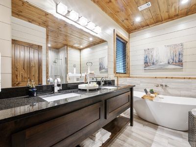 The private bathroom with double vanity and a soaking tub!