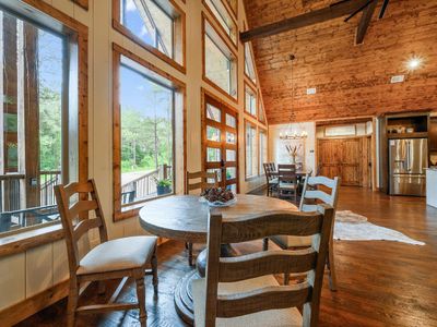 4 additional seats at a separate dining table.