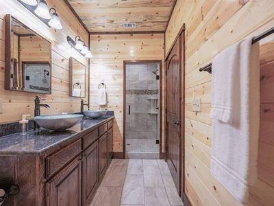 The full bathroom comes with double vanity and a walk-in shower.