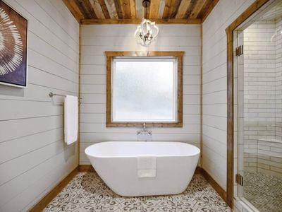 A soaking tub in this private bath!