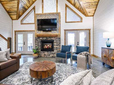 The heart of the living room is the stone fireplace and smart TV!