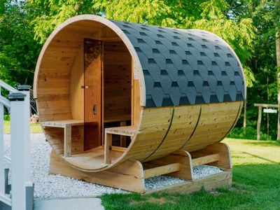 This backyard barrel sauna is a perfect place to unwind.