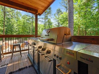 The gas grill on the covered patio!