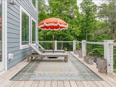 The spacious back deck is the place to be on a warm summer day
