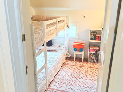 Looking into this cozy and cute bunk room.