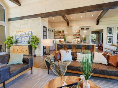 Sink into plush comfort and let the glow of the high-ceilinged living room set the tone for pure relaxation.