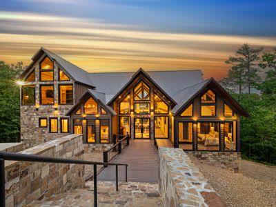 Welcome to Glass and Timber, your luxurious woodland sanctuary tucked deep within the towering, mature trees of Broken Bow.