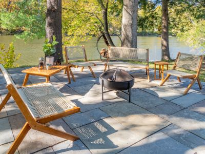 Fire pit and patio furniture along the river.