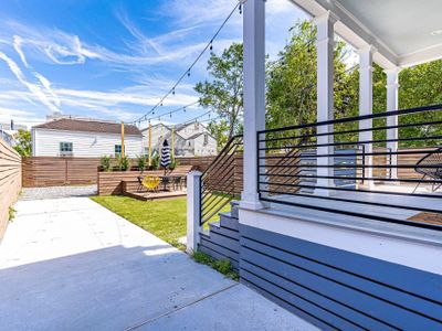 Seating on the covered rear porch and a spacious backyard with a deck and seating for 10! But wait, there's more!