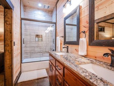 Equipped with a shower/tub combo.