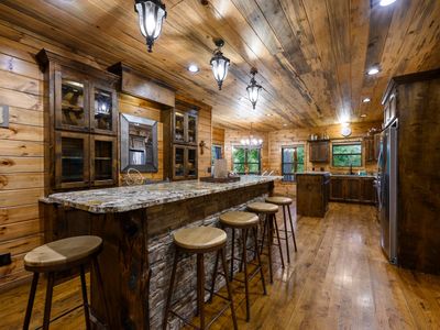 6 seats at the bar in the kitchen.