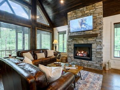 Luxury couches surrounding the stone fireplace!