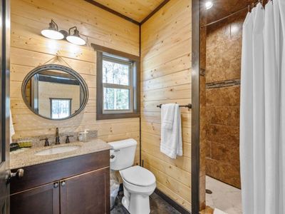 Full bathroom for the game house with a walk-in shower.