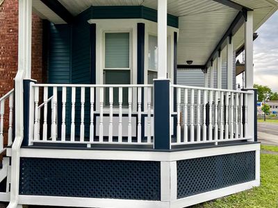 Enjoy access to the porch from the front or side of the house