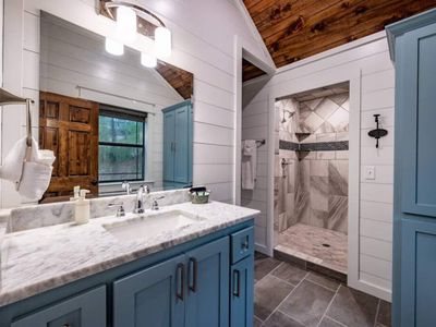 Equipped with a private bathroom featuring a walk-in shower.