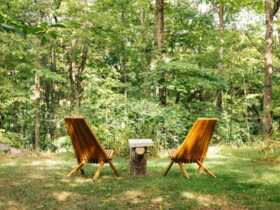 The outdoor space makes for a delightful oasis among the trees.