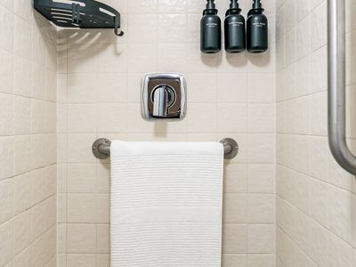 Shower room located inside train car.