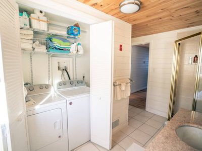 Guest bathroom with shower and washer and dryer