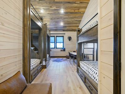 The bunk room with 4 Queen beds and 2 XL Twin beds!