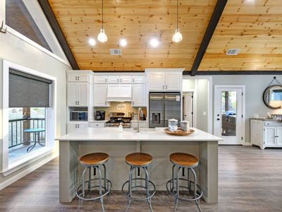 The kitchen offers additional seating at the bar top!