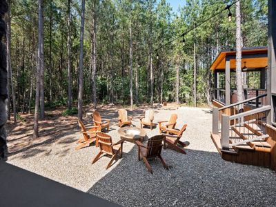 Fire pit with Adirondack chairs.