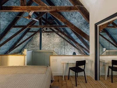 You'll be hard pressed to find a more unique place to rest your head than The Rifton's loft bedroom, tucked under the eaves of this 1876 church.