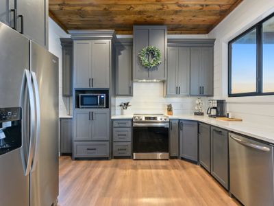 The kitchen is equipped with all of the stainless steel appliances you need!