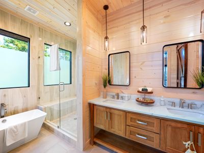Relax and unwind in a serene retreat featuring a modern soaking tub!