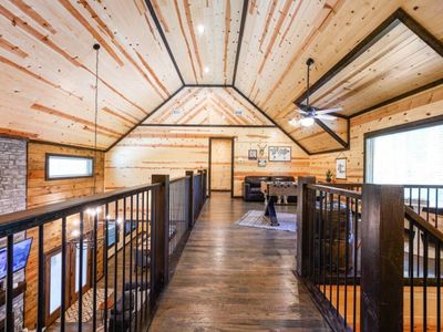 The upstairs loft with a sleeper couch and foosball.