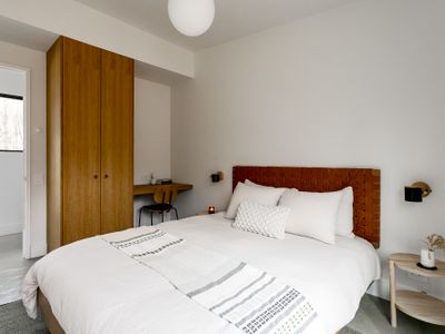 Clean and serene  bedroom with soft lighting for ultimate relaxation