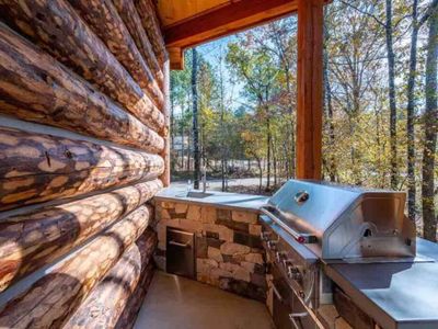 The outdoor kitchenette with a gas grill (propane provided).