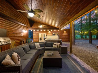 The covered patio has an oversized outdoor sectional.