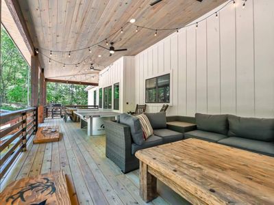 An oversized sectional and other entertainment can be found on the outdoor patio.