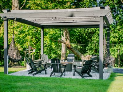 Whether in an Adirondack chair or hammock swing, you'll love sitting by the fire pit.