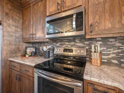 Electric stovetop with an oven and microwave.