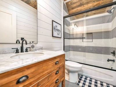 The private bathroom has a tub/shower combo.