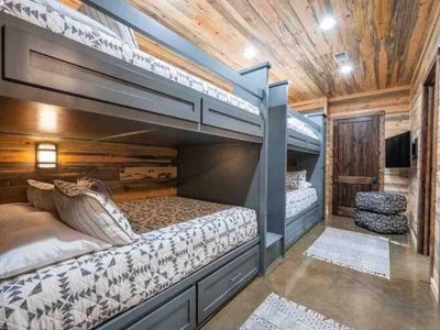 The bunk room is also downstairs and has 4 Queen beds.