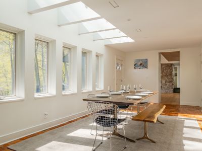 Skylights and wall-to-wall windows make this dining space an absolutely delight.