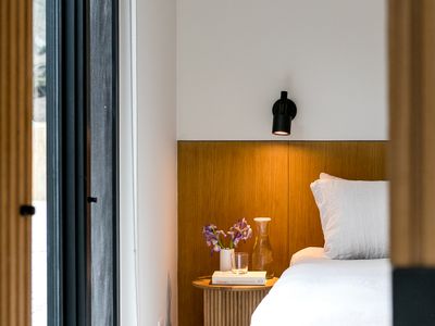 Cozy primary bedroom with soft ambient lighting.