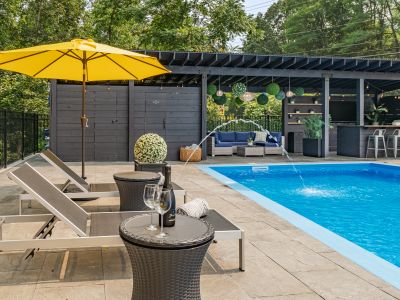 These unique tables double as poolside coolers. Simply pop up the top, fill with ice and voila- cold champagne on a hot day.