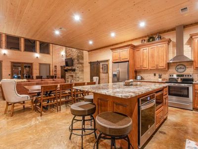 A formal dining area as well as seating at the bar top.