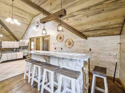Additional bar-top seating is available in the loft!