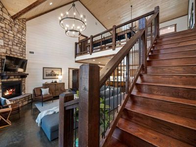 Upstairs leads to the loft and additional bedrooms.