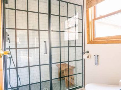 Primary bath featuring rainfall shower and Toto electric bidet/toilet.