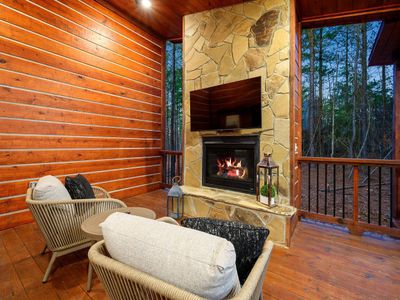 The third gas fireplace can also be found outside with luxury lounging chairs!