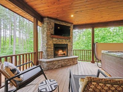 The outdoor entertainment space features an electric fireplace and seating!