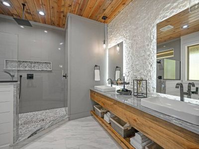 The private bath has a walk-in rain shower as well as double vanity!