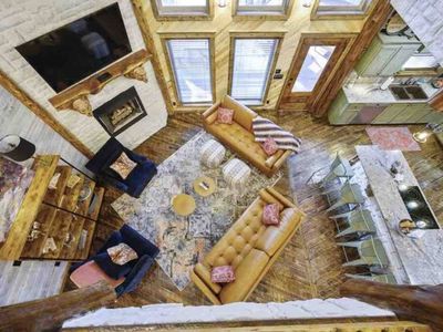 Birds-eye view of the ground level living room and kitchen.