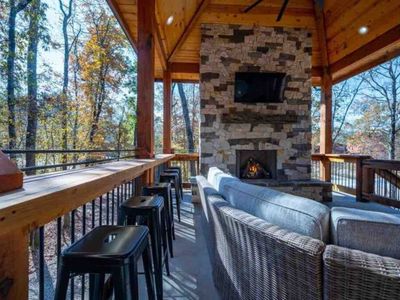Bar top seating and the outdoor gas fireplace!